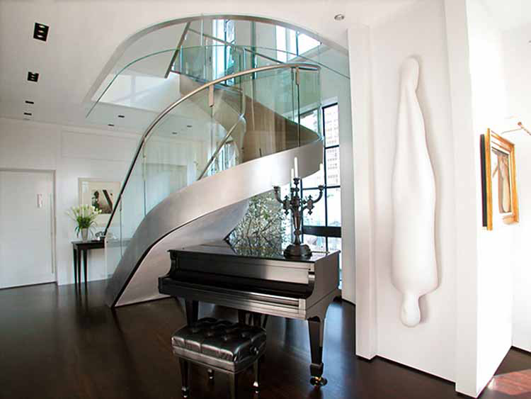 Lifetime Luxury Amazing Stair Design - curved staircase turning left with silver iron handrail, glass panel balustrade and silver metal skirt board - 051